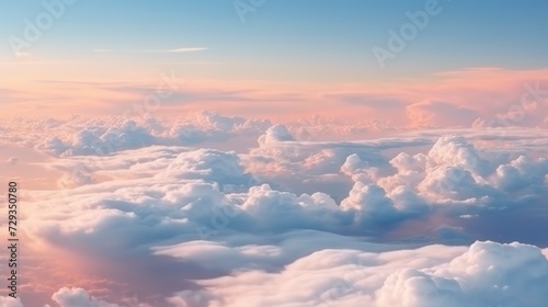 Beautiful aerial view above clouds at sunset. Flying above clouds