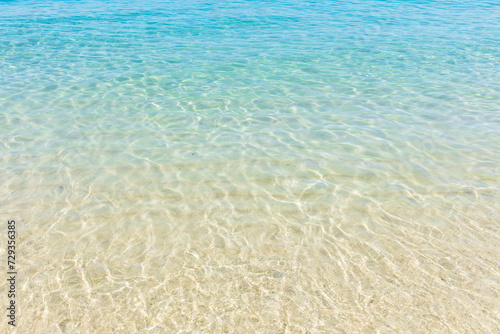 Fototapeta Naklejka Na Ścianę i Meble -  Close-up of the crystal clear waters and gradient of the sea at Praia do Dentist, one of the most beautiful beaches in Brazil and Rio de Janeiro.