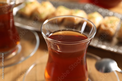 Traditional Turkish tea in glasses on table, closeup