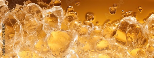 a glas of light light yellow brown soda, with alot of bubbles and smal fizzes and couple of ice cubes. Zoomed in so we see the top half of the glas, Perspective zoomed in on surface, from slighty abov
