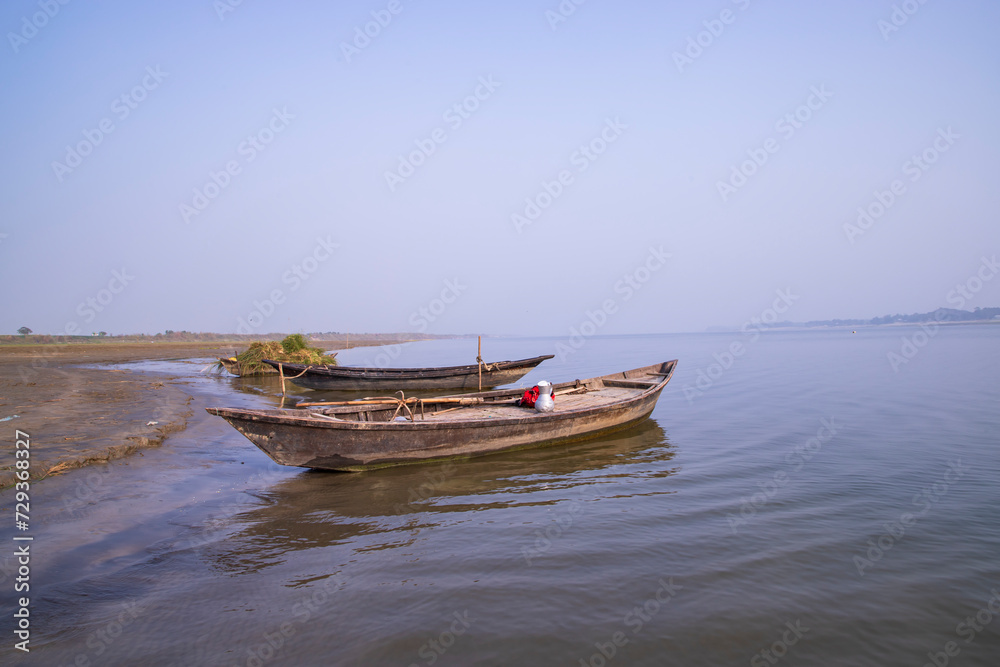 landscape view of Some wooden fishing boats on the shore of the Padma river in Bangladesh