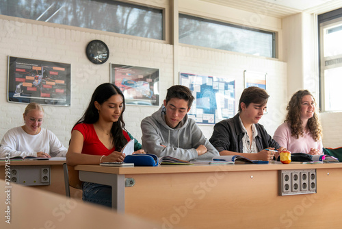 Mix nationality students in a european classroom studying  photo
