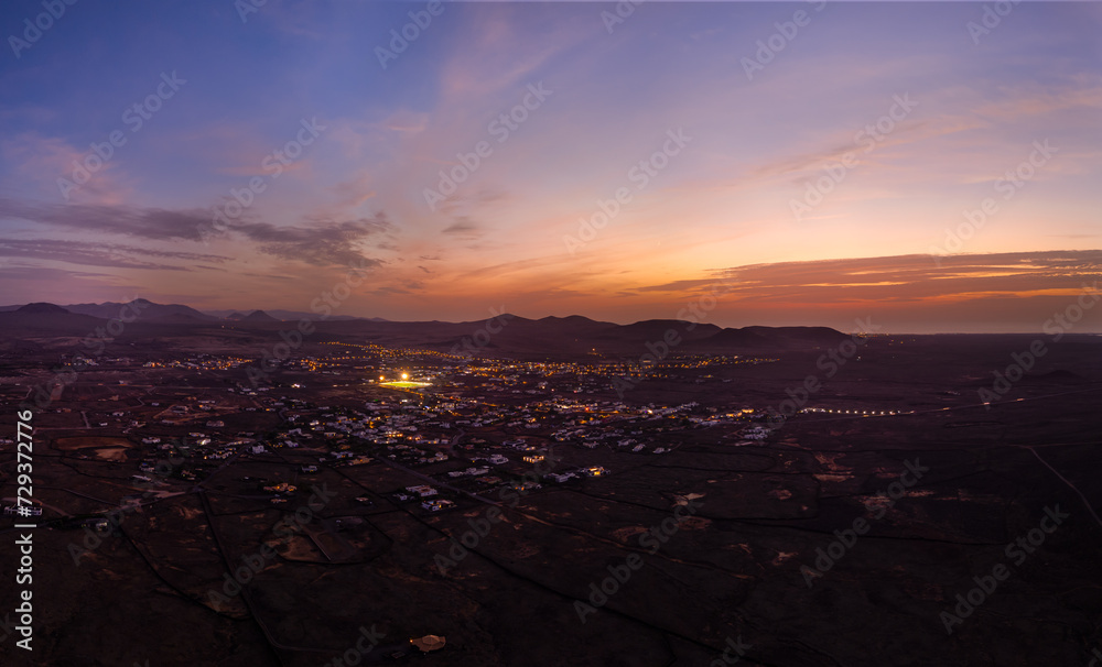 Spectacular sun set image over Lajares village against the setting sun and skyscape near Corralejo, Fuerteventura, Canary Islands, Spain