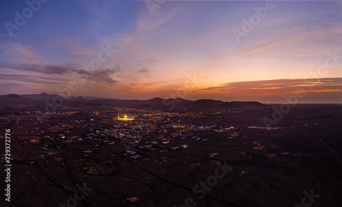 Spectacular sun set image over Lajares village against the setting sun and skyscape near Corralejo, Fuerteventura, Canary Islands, Spain
