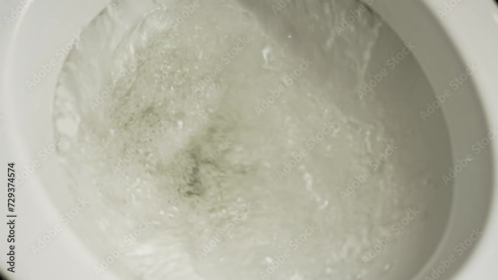 Flush toilet. Water flushes the toilet with toilet paper