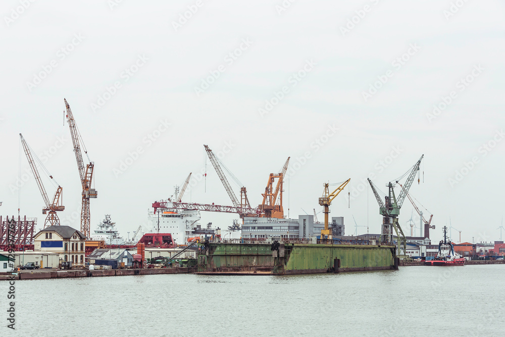 Industrial ships and cranes in a harbor. Bremerhaven, Germany Industrial ships and cranes in a harbor. Bremerhaven, Germany