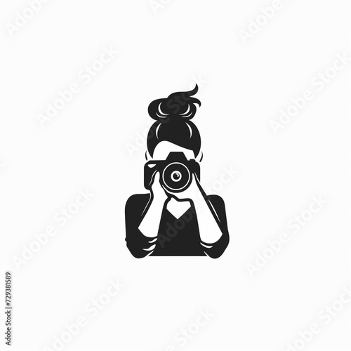 Vector Logo Design Template: Silhouette of a Woman Holding a Camera, Creating a Modern Emblem for Photography, Presented in Flat Design on a White Background © NadinMich