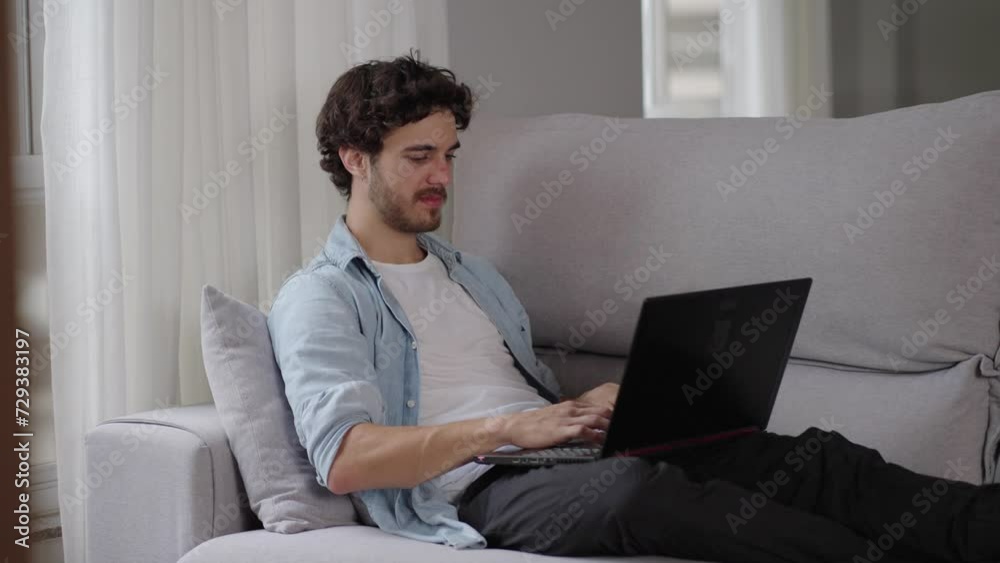 Relaxed serious millennial caucasian guy student freelancer using laptop device leaning on sofa at home office, focused entrepreneur working distantly typing on notebook in apartment
Relaxed serious millennial caucasian guy student freelancer using laptop device leaning on sofa at home office, focused entrepreneur working distantly typing on notebook in apartment