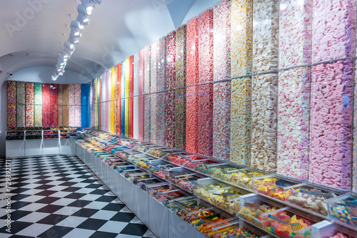 Photos showcase of candy shop, transparent container with various sweets, marshmallow,