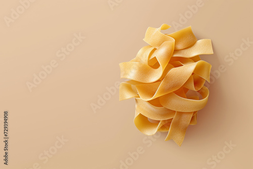Pasta pappardelle, close up. Light brown background, top view. Space for text.