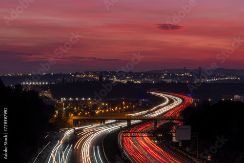 Elevated view of the AP-7 motorway at dusk as it passes through Mollet del Valles in the province of Barcelona in Catalonia Spain photo