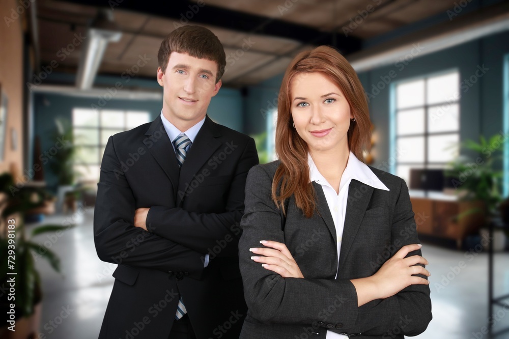 Successful happy business team standing at office interior. Successful happy business team standing at office interior.