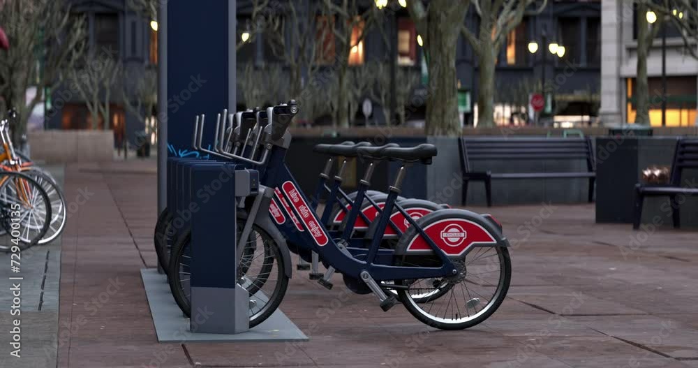 3D animation of generic Electric bicycle charging station. Shared electric bikes parked for rent on city street 3D animation of generic Electric bicycle charging station. Shared electric bikes parked for rent on city street