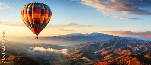 Hot air balloon in the blue sky over the mountains. photo