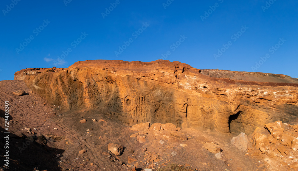 Strange rock carvings in sandstone rock face near Corralejo and  Lajares Fuerteventura Canary Islands Spain