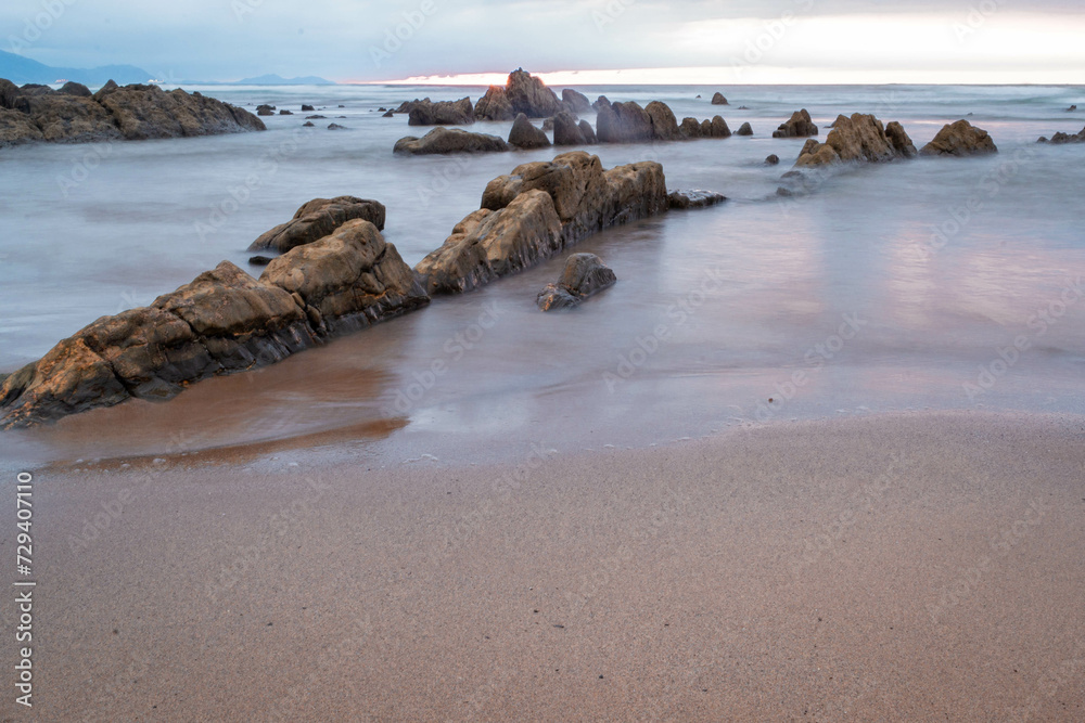 rocks on the beach water silk rocks on the beach water silk