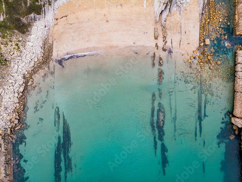 sea rocks beach turquoise water aerial topview