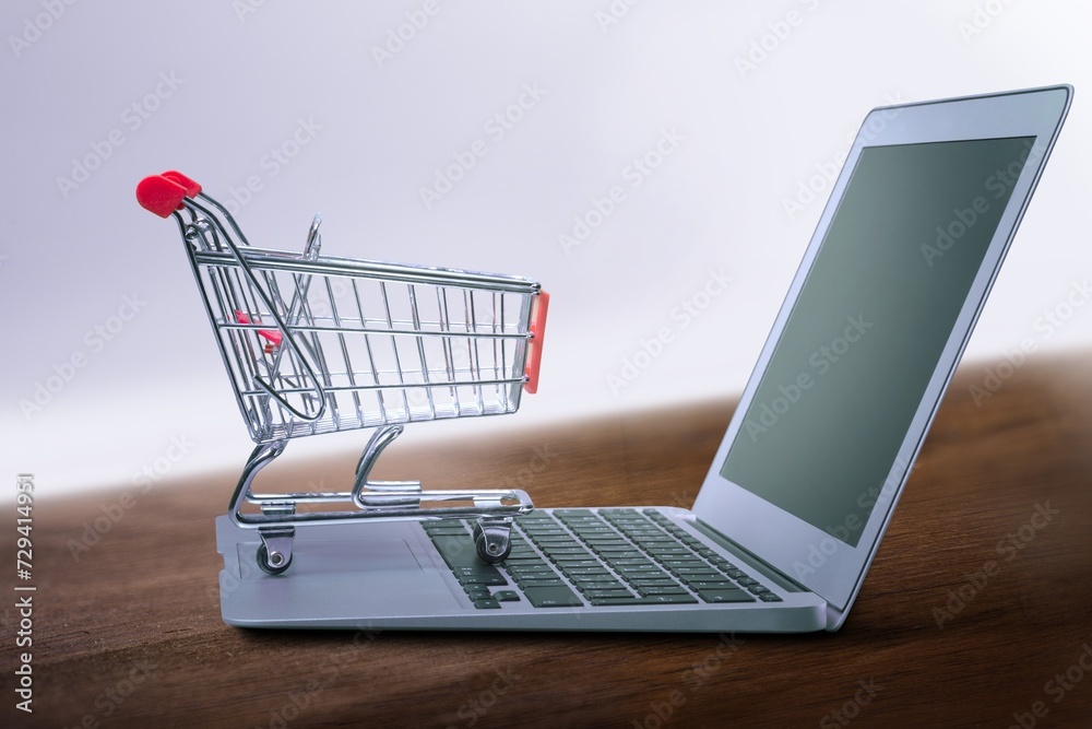 Laptop computer and shopping cart on desk
