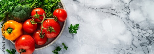 selection of healthy vegetables in a bowl on light marble