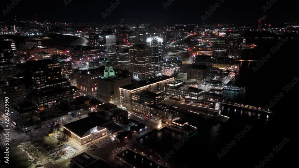 Cinematic drone view of Halifax city at night with skyscrapers and city traffic in downtown, Canada, Nova Scotia. Night in Halifax, downtown, cityscape, skyline, skyline towers - Cityscape Cinematic drone view of Halifax city at night with skyscrapers and city traffic in downtown, Canada, Nova Scotia. Night in Halifax, downtown, cityscape, skyline, skyline towers - Cityscape