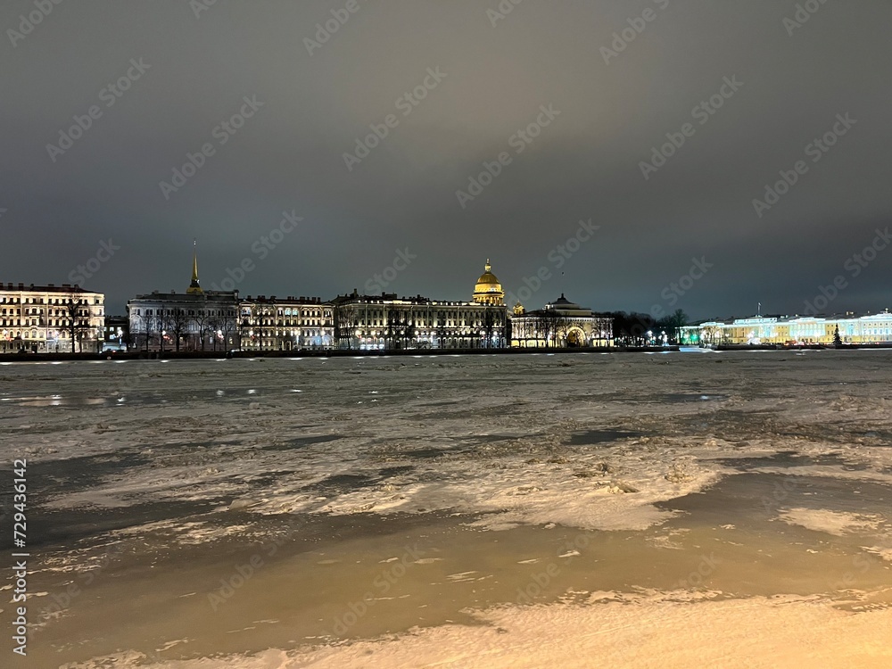 Iced river in the city, nighttime, illumination 
