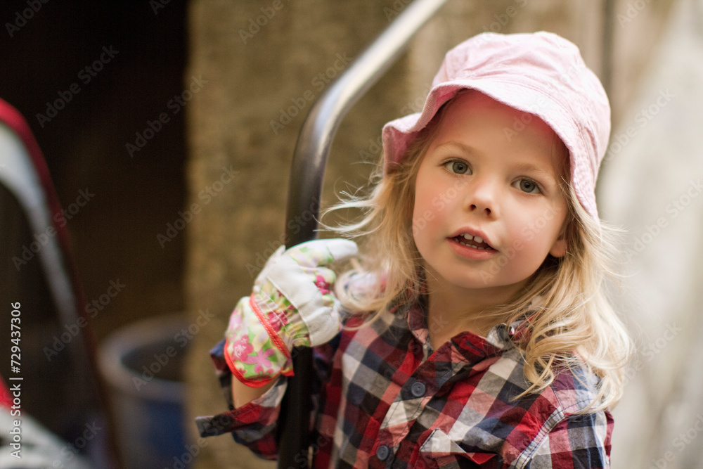 portrait of a little girl in the garden portrait of a little girl in the garden