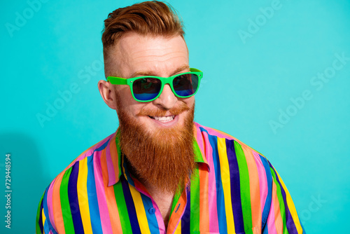 Portrait of handsome cheerful boyfriend in hipster shirt toothy smiling wear sunglasses rayban brand isolated on cyan color background