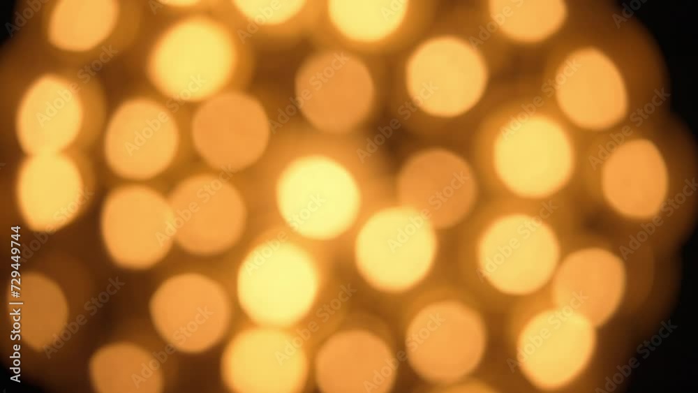 Flame of burning candles in defocus. Blur with bokeh effect from burning candle flame. Memorial Day. Background for holiday, advertising and design projects. Top view. Flame of burning candles in defocus. Blur with bokeh effect from burning candle flame. Memorial Day. Background for holiday, advertising and design projects. Top view.