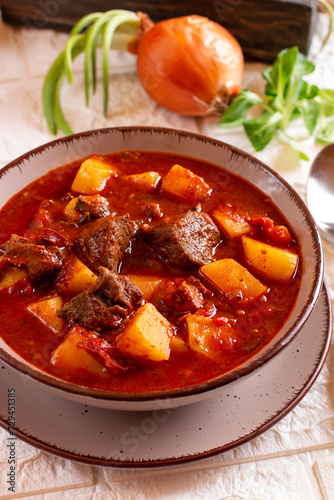 Goulash soup with beef, potatoes and sweet pepper. Stew of meat and vegetables, flavored with paprika. Hungarian cuisine.