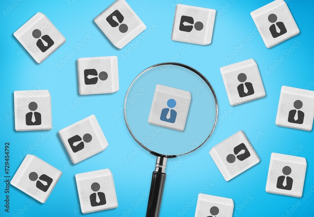 Magnifying glass and cubes with person icons Magnifying glass and cubes with person icons