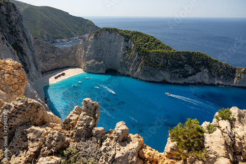 Aerial view of Navagio beach on Zakynthos island, Greece. Shipwreck Beach or Agios Georgios. is exposed cove in the Ionian Islands of Greece. Shipwreck on the beach in Zakynthos island, Greece. © Chawran