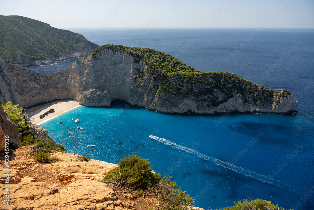 Obraz premium Aerial view of Navagio beach on Zakynthos island, Greece. Shipwreck Beach or Agios Georgios. is exposed cove in the Ionian Islands of Greece. Shipwreck on the beach in Zakynthos island, Greece.