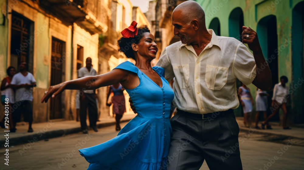 Fototapeta premium Energetic Cuban couple dancing salsa on a street in Cuba