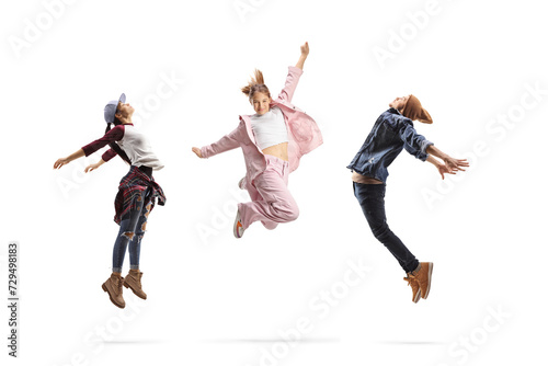Fototapeta Naklejka Na Ścianę i Meble -  Group of young people performing dance jumps