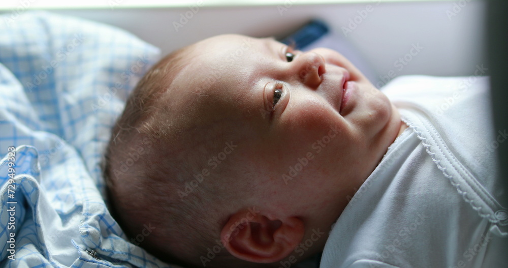 Adorable cute baby newborn looking and observing Adorable cute baby newborn looking and observing