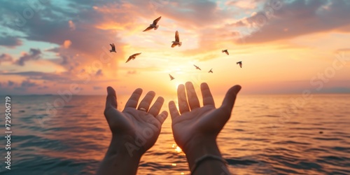 People With Open Hands Worship As Birds Fly Over Calm Water At Sunset. Сoncept Sunset Reflections, Serene Waters, Worship And Nature, Tranquil Moments, Open Hands And Freedom