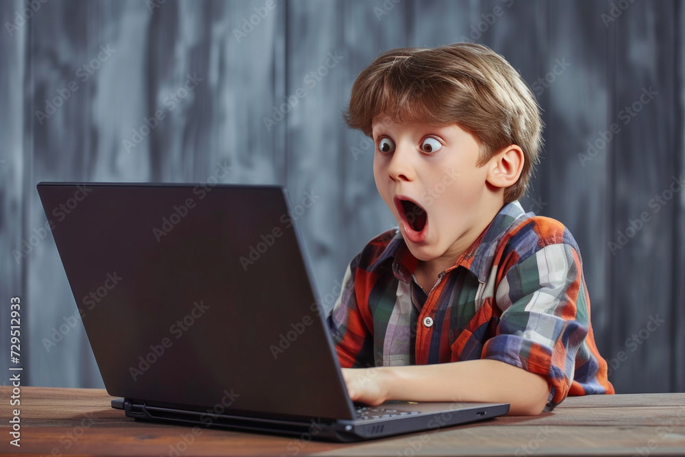 Astonished young man using laptop online Astonished young man using laptop online