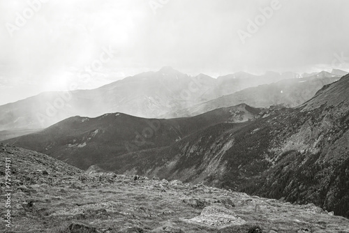 Classic black and white Rocky Mountain panoramic landscape of approaching snowstorm in Colorado, USA