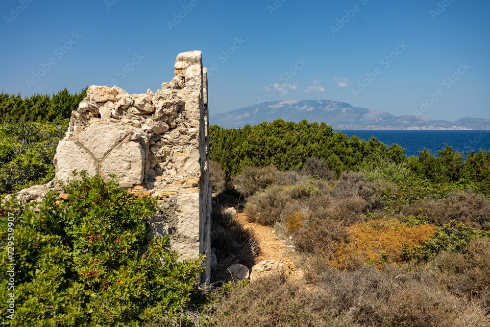 Greece, Zakynthos, Road to skinari lighthouse at zakynthos island north cape. Ancient ruins on Skinari cape in sunny summer day. Zakynthos island, Greece