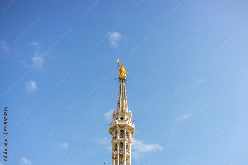 Statue of the Virgin Mary on top of Duomo Cathedral, Milan Cathedral. Madonna Golden Statue Perfect Bronze Replica in Milan, Italy Statue of the Virgin Mary on top of Duomo Cathedral, Milan Cathedral. Madonna Golden Statue Perfect Bronze Replica in Milan, Italy