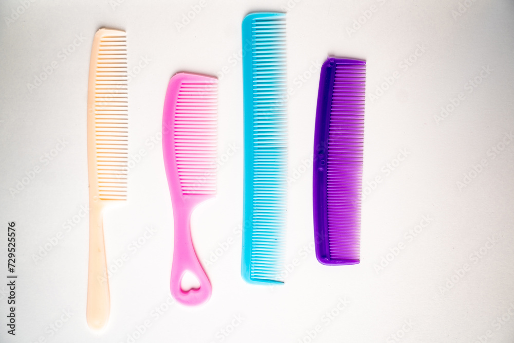 multi-colored hair combs on a white background multi-colored hair combs on a white background