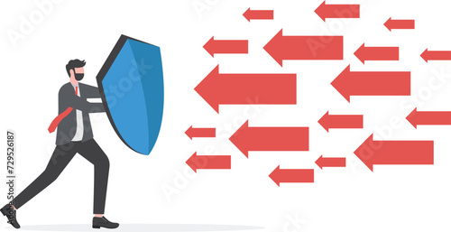 Businessman used a shield to resist the arrow. Business risk protection concept

