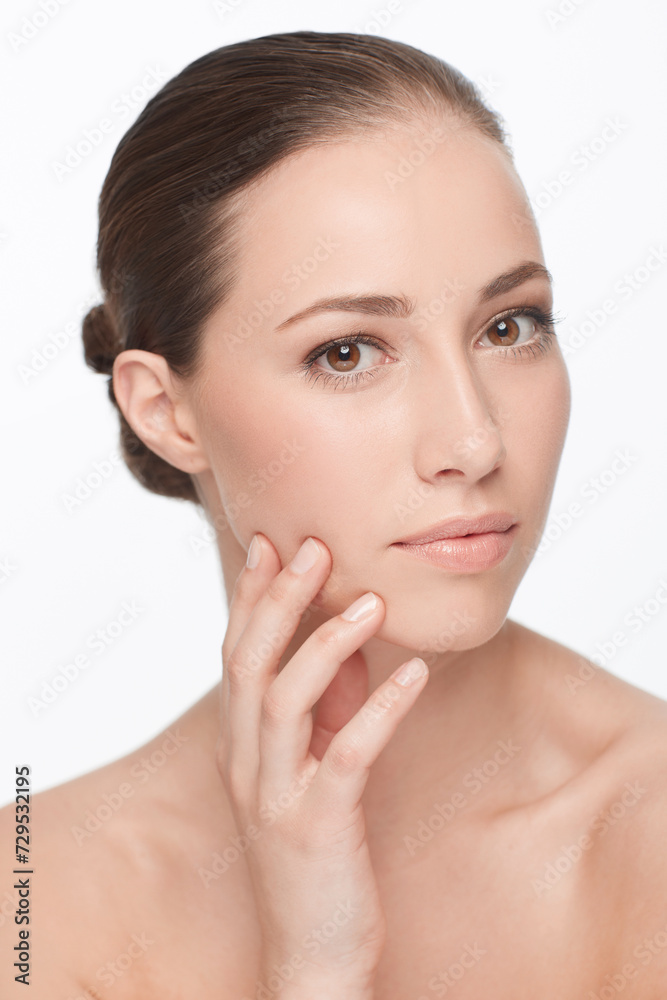 Woman, hand on face and skincare for natural beauty, hygiene and wellness with dermatology and self care on white background. Portrait, facial and touching skin, glow and cosmetics in studio