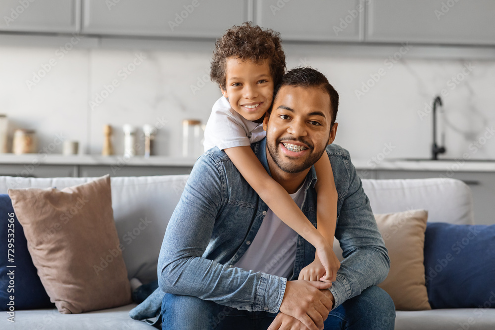 Father Son Love. Happy Black Man And Preteen Son Hugging At Home