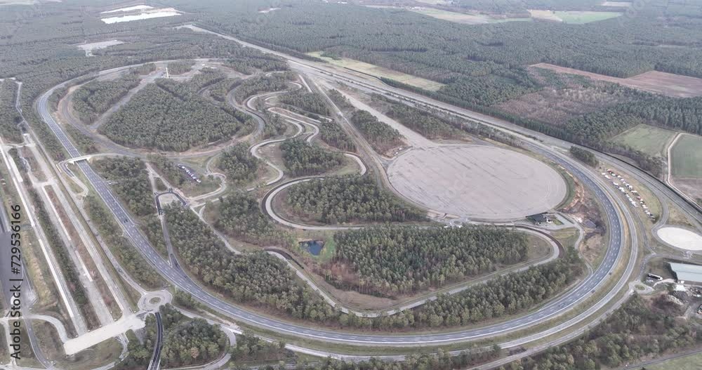 Lommel Proving Ground is a test track for road vehicles, located south of the Belgian hamlet of Kattenbos, Lommel and covers an area of 322 hectares. Birds eye aerial drone view. Lommel Proving Ground is a test track for road vehicles, located south of the Belgian hamlet of Kattenbos, Lommel and covers an area of 322 hectares. Birds eye aerial drone view.