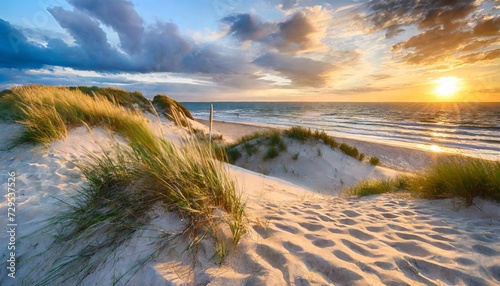 sand dunes on the beach at sunset photo