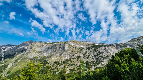Panoramic view of alpine landscape seen from Allakogel, Hochschwab mountains, Styria, Austria. Wanderlust in wilderness of Austrian Alps, Europe. Hiking trail in Muerztal valley Obersteiermark, summer