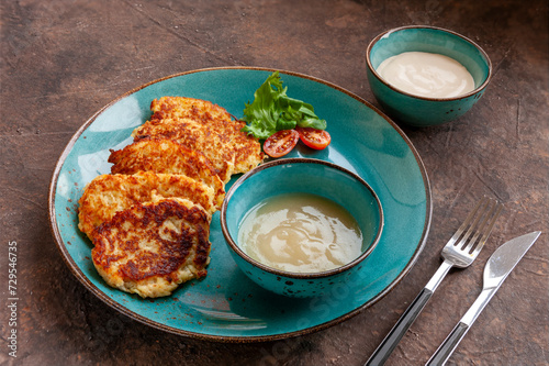 Traditional Potato Pancakes Levivot Latkes for Hanukkah Jewish Holiday with apple puree and sour cream photo