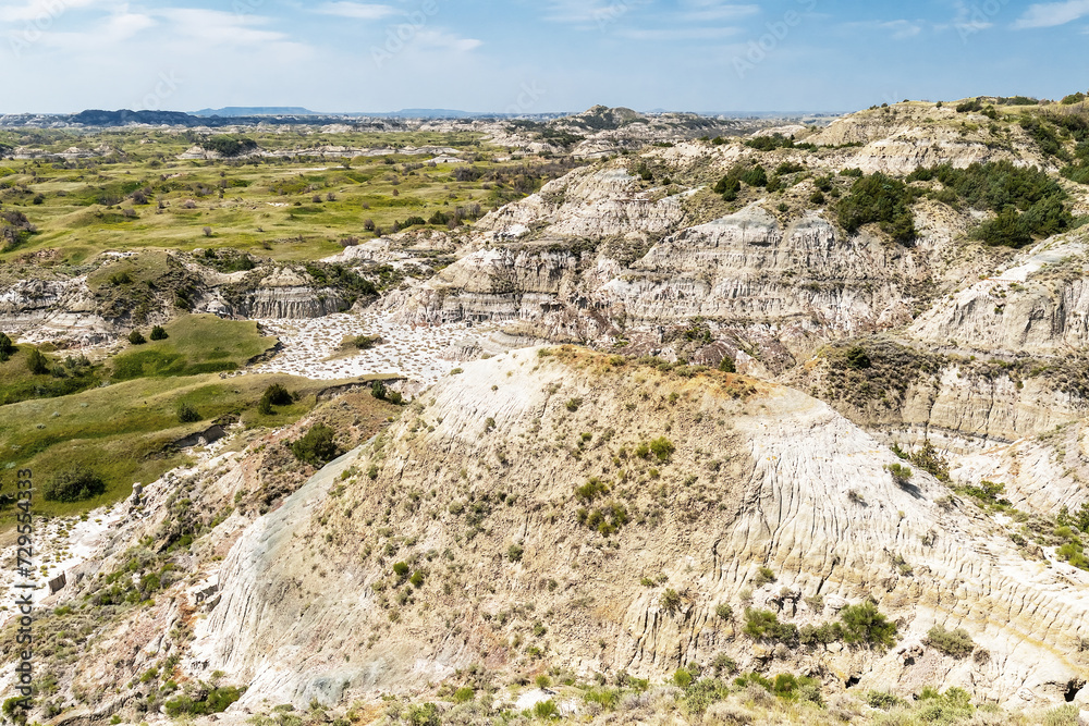 Panoramic summer landscape view of buttes and prairie wilderness in Theodore Roosevelt National Park North Dakota, USA