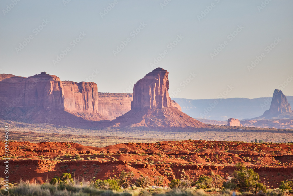 Fototapeta premium Golden Hour Glow on Red Sandstone Buttes, Monument Valley